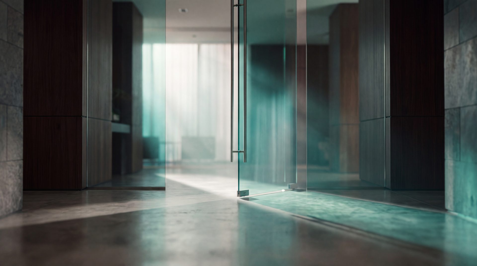 An open glass door into a bright office